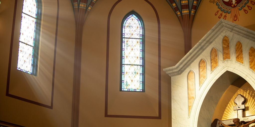 a statue of jesus on a cross in a church